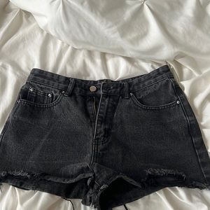 Faded black denim shorts.